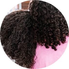 back of two girls with mixed texture hair