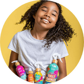 young girl holding four colorful niles and chaz hair care product bottles