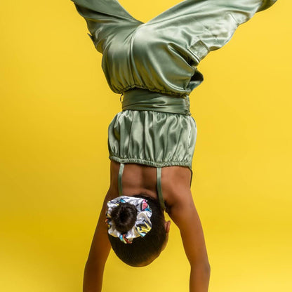 young girl doing handstand